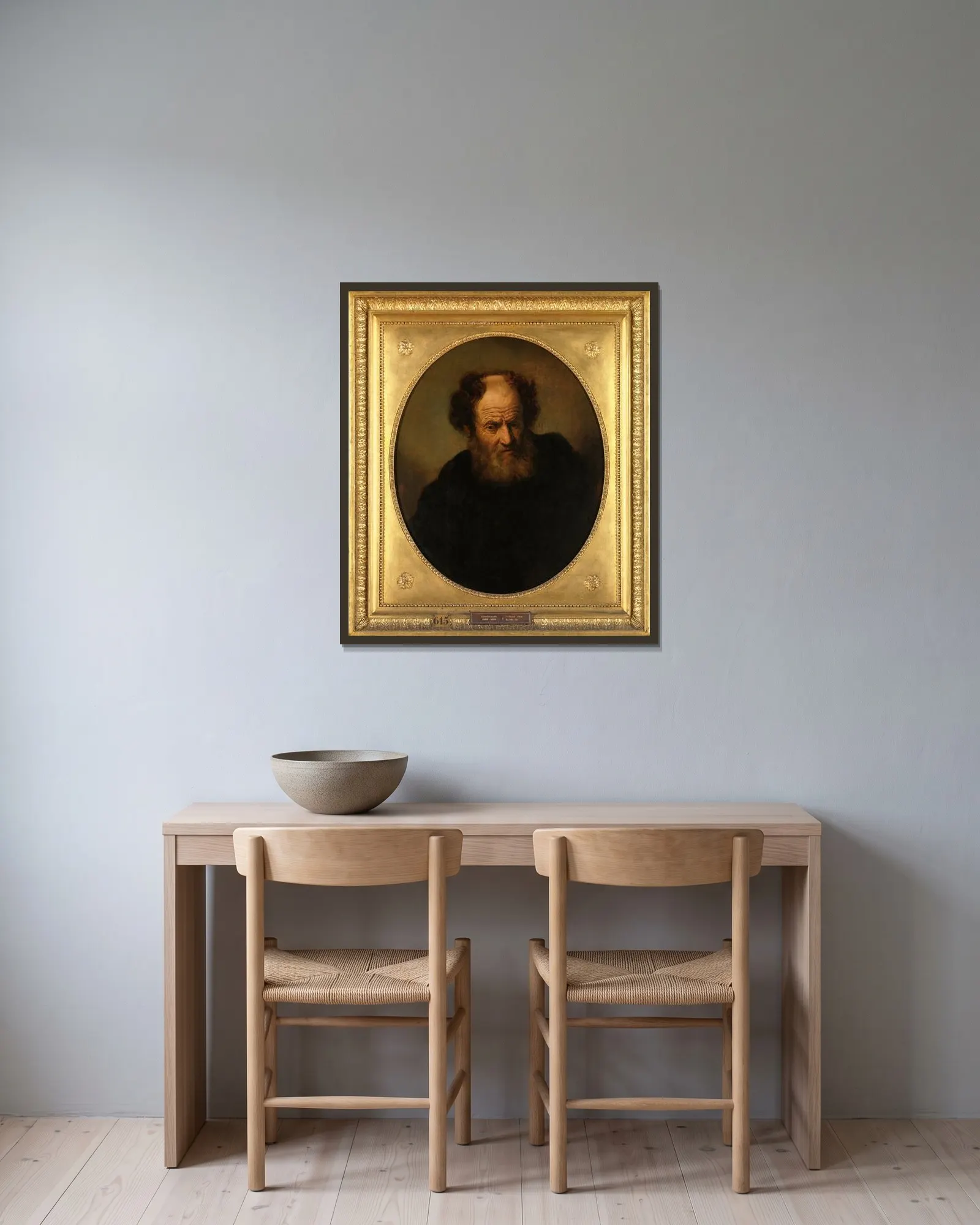 An Old Man av Rembrandt van Rijn inramad på en vägg