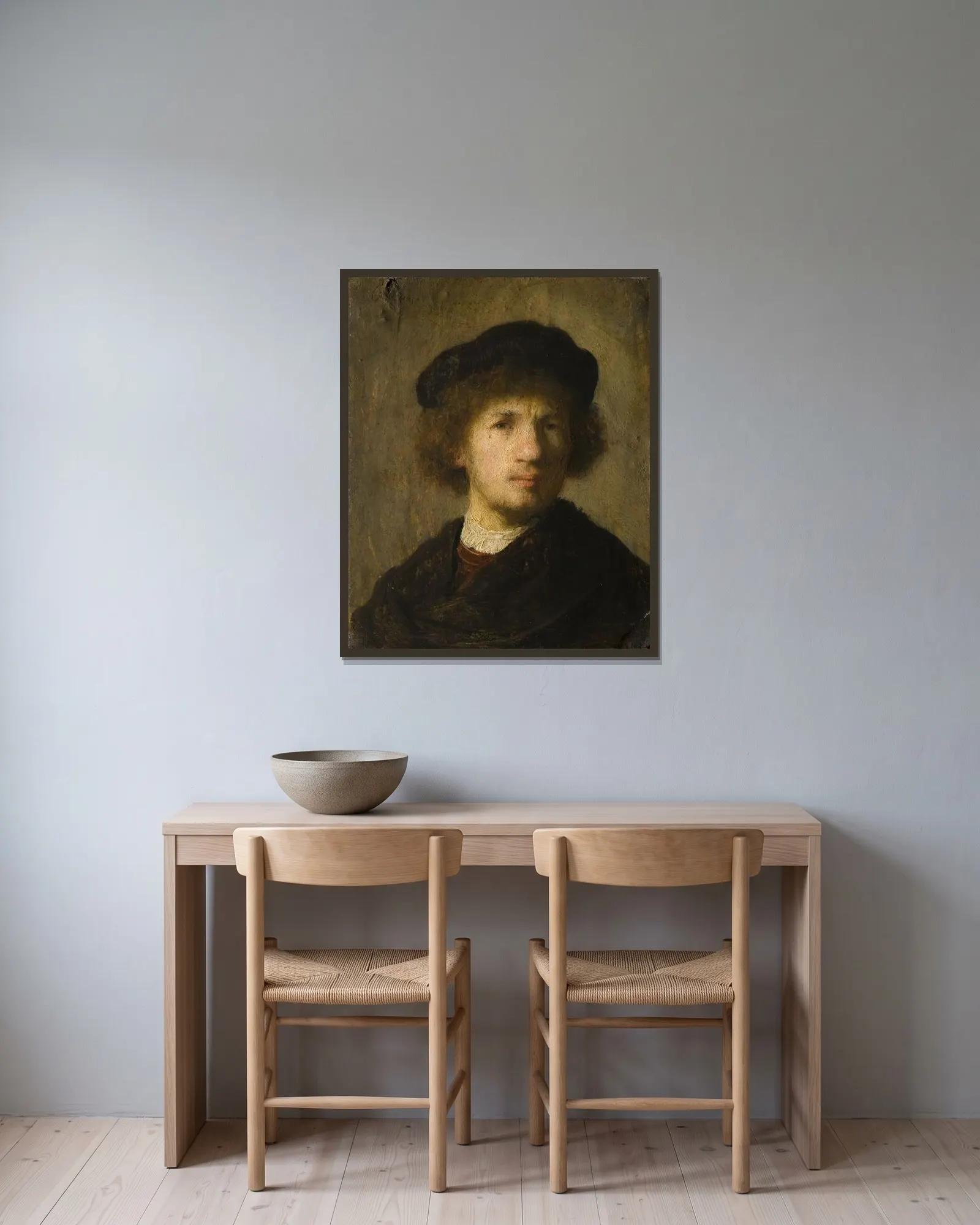 Self-portrait av Rembrandt van Rijn inramad på en vägg