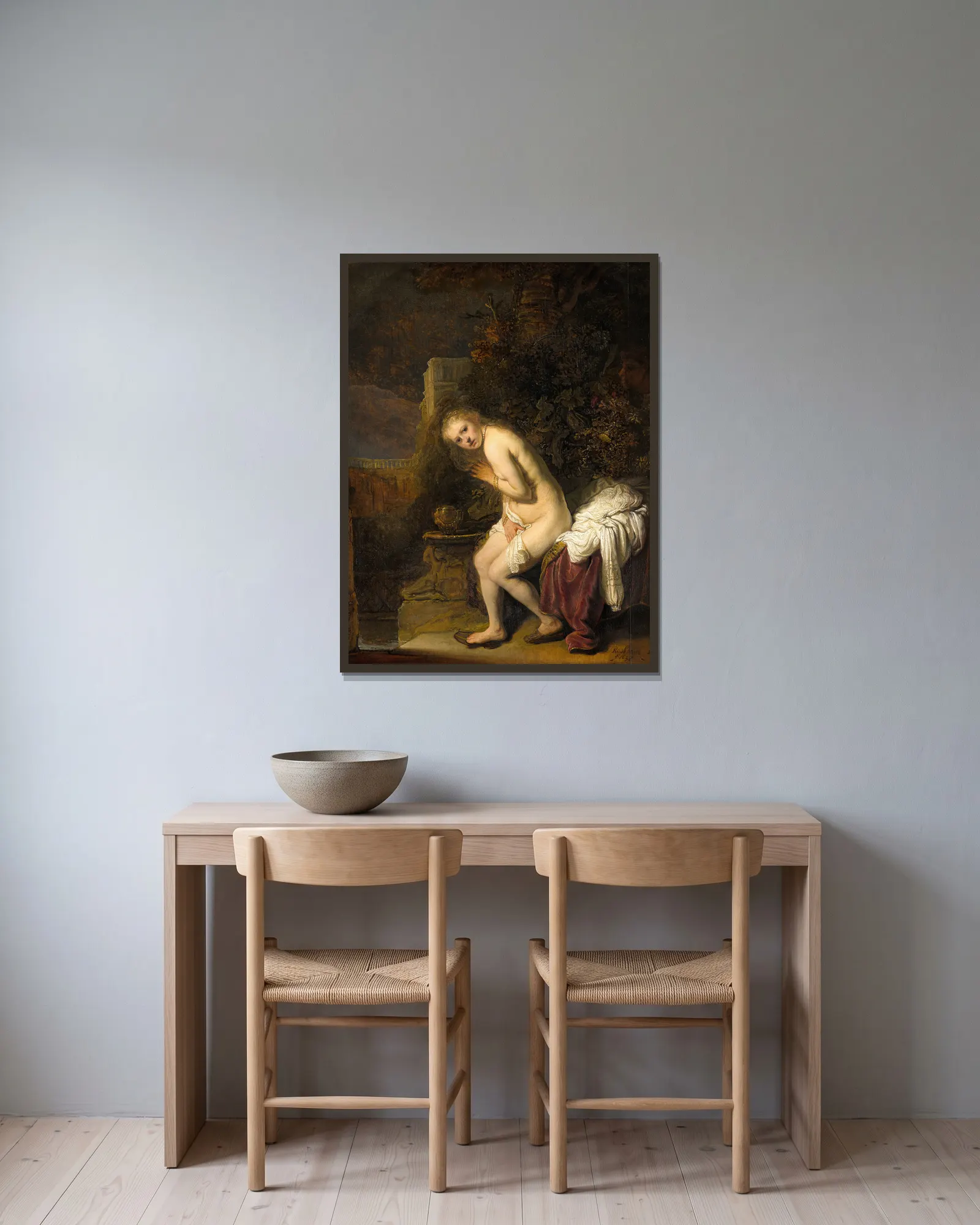Susanna av Rembrandt van Rijn inramad på en vägg