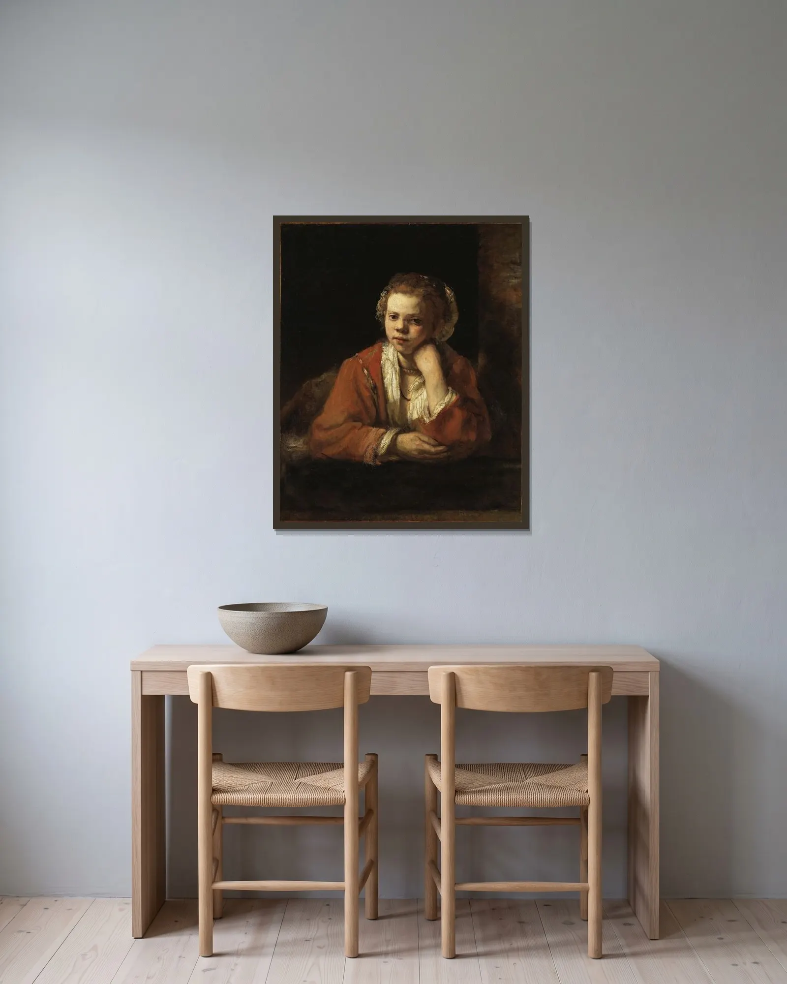 The Kitchen Maid av Rembrandt van Rijn inramad på en vägg