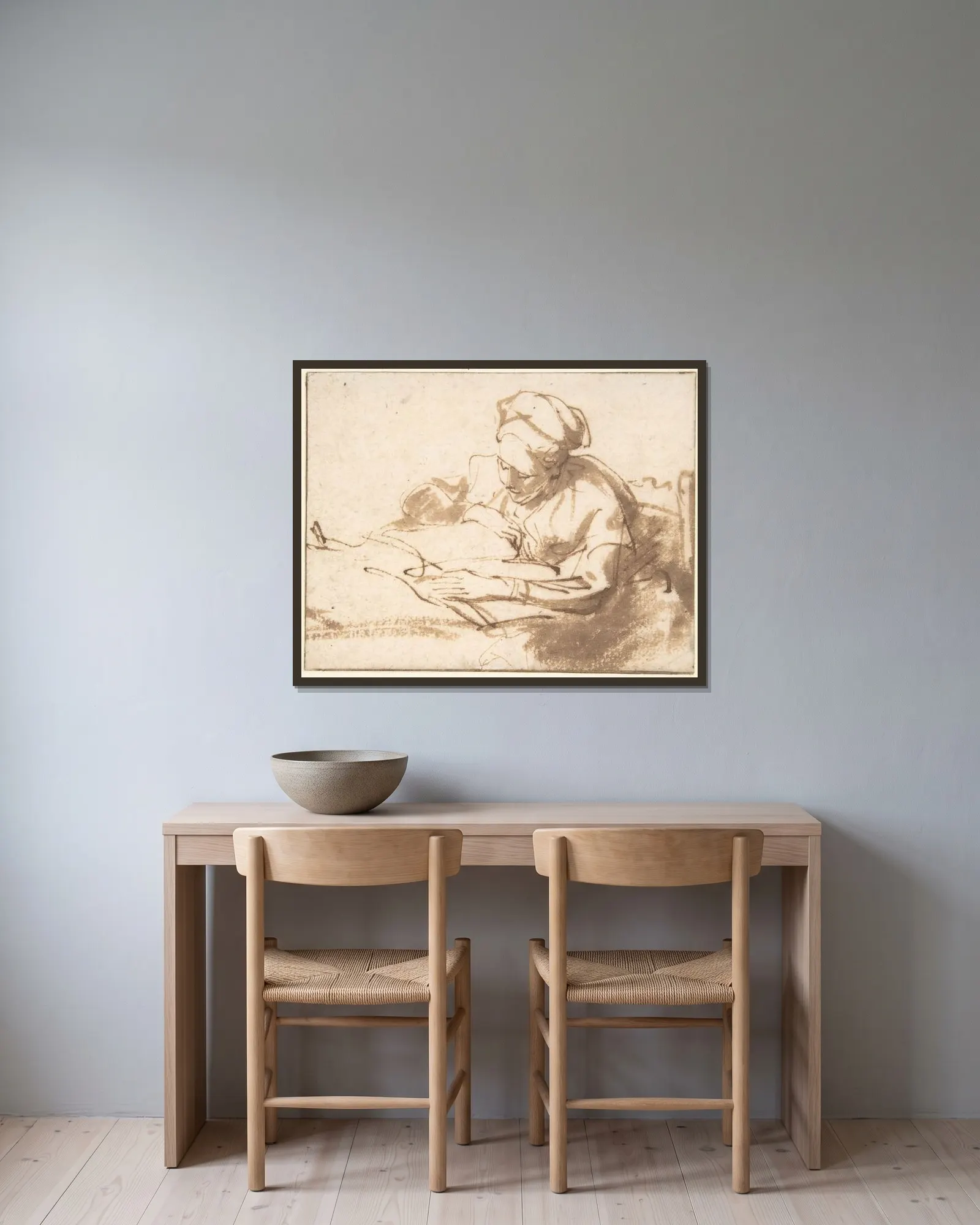 Woman Reading – nr 1 av Rembrandt van Rijn inramad på en vägg