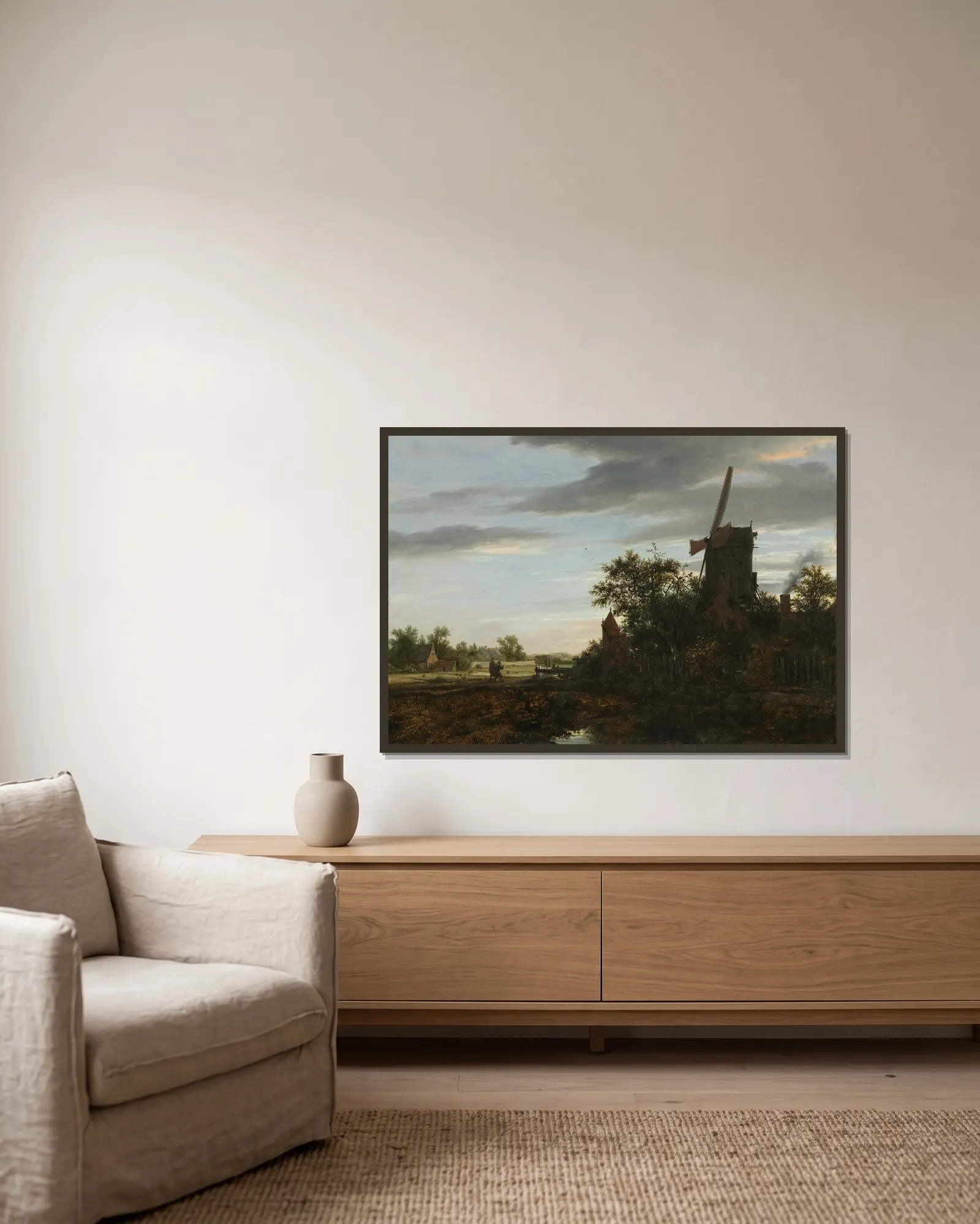 Landscape with a Windmill av Jacob van Ruisdael inramad på en vägg