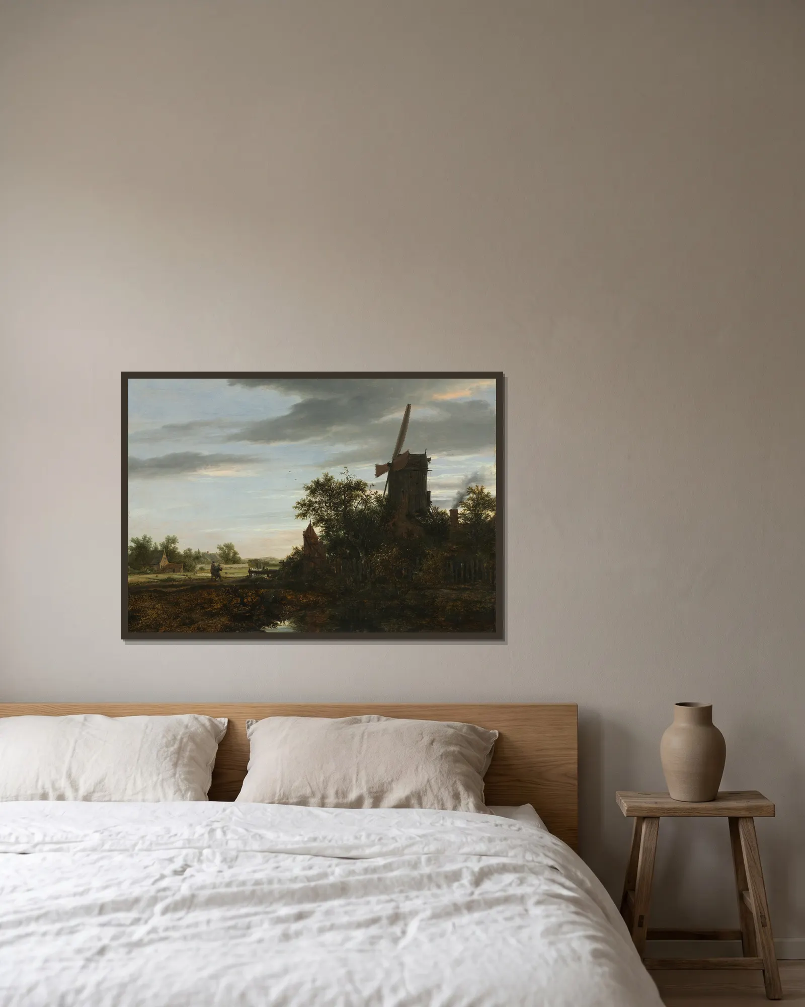 Landscape with a Windmill av Jacob van Ruisdael inramad på en vägg