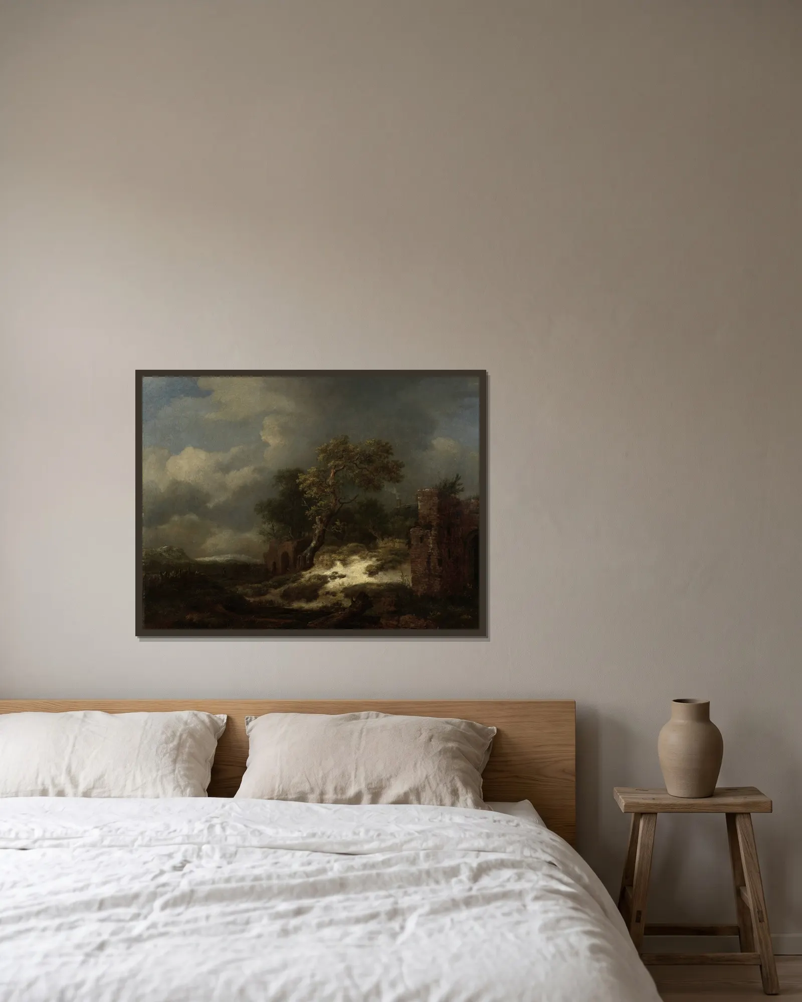 Landscape with Ruins av Jacob van Ruisdael inramad på en vägg