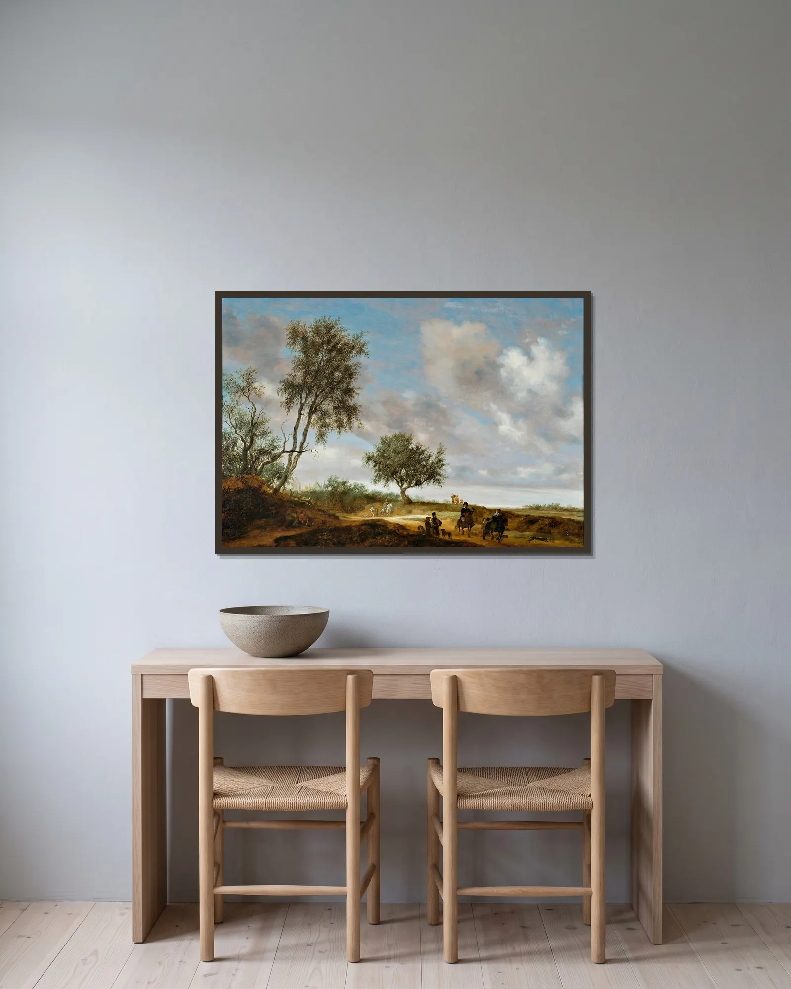 Landscape with hunters av Salomon van Ruysdael inramad på en vägg