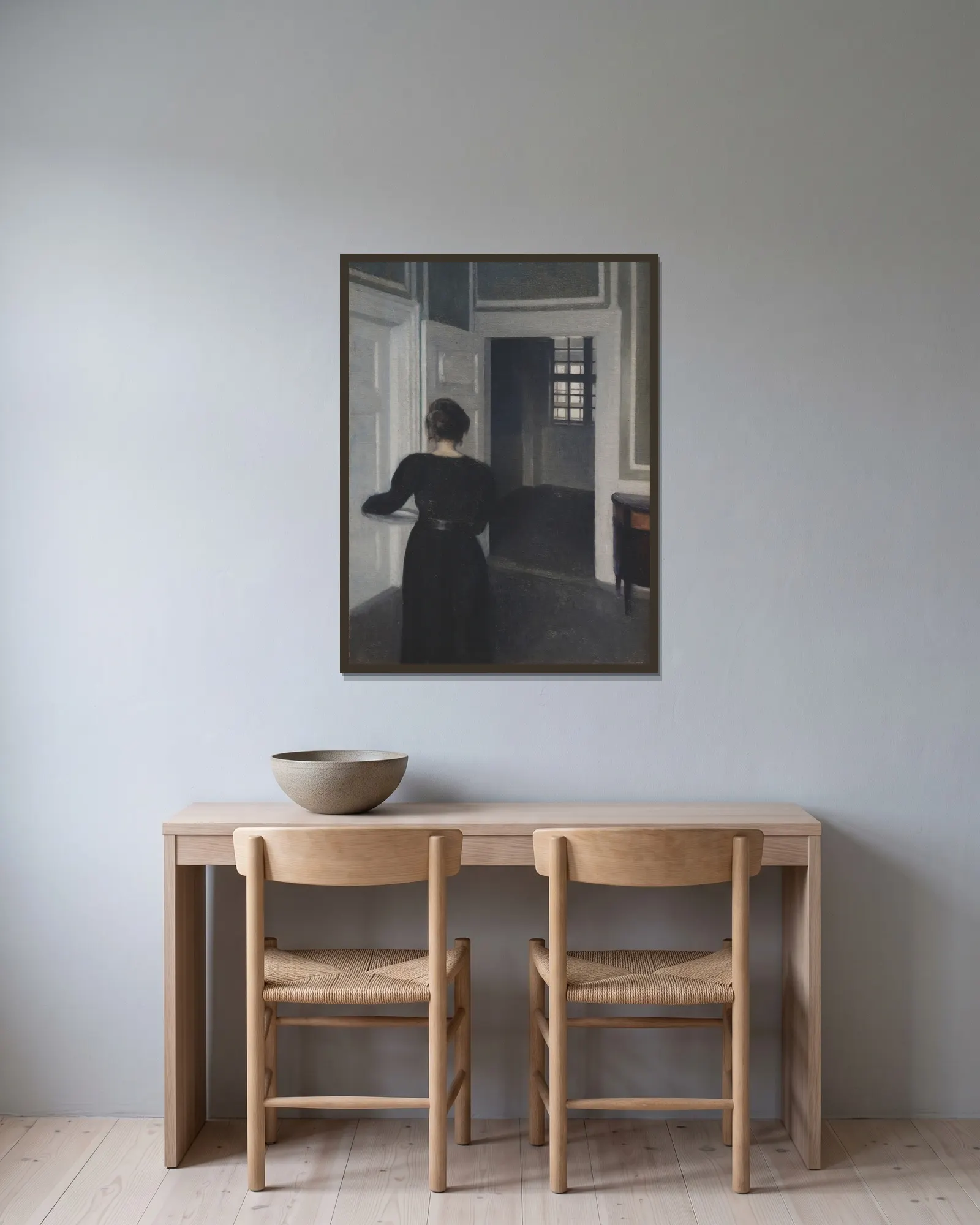 Ida In An Interior av Vilhelm Hammershøi inramad på en vägg