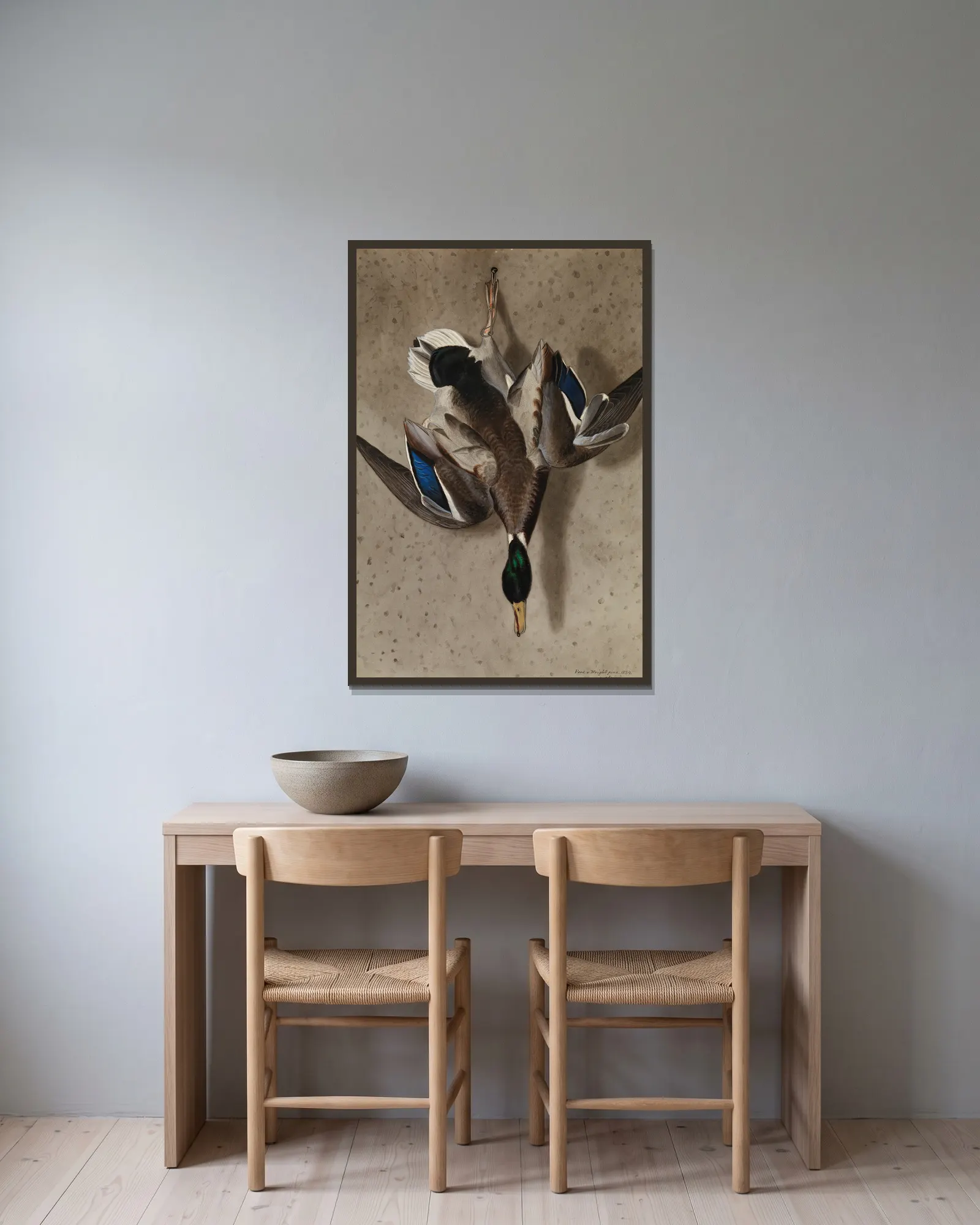 Hanging Mallard av Ferdinand von Wright inramad på en vägg