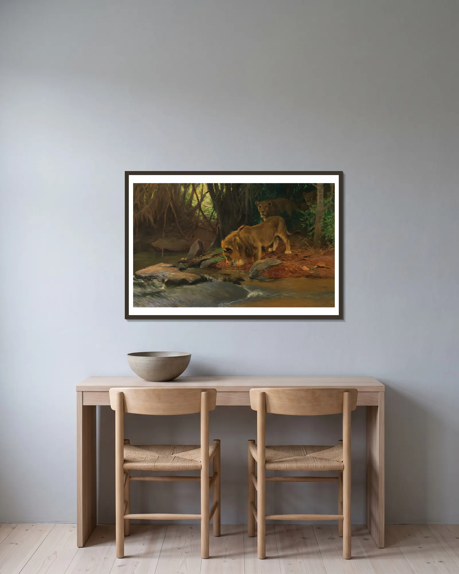 Löwen am Urwaldbach av Wilhelm Kuhnert inramad på en vägg
