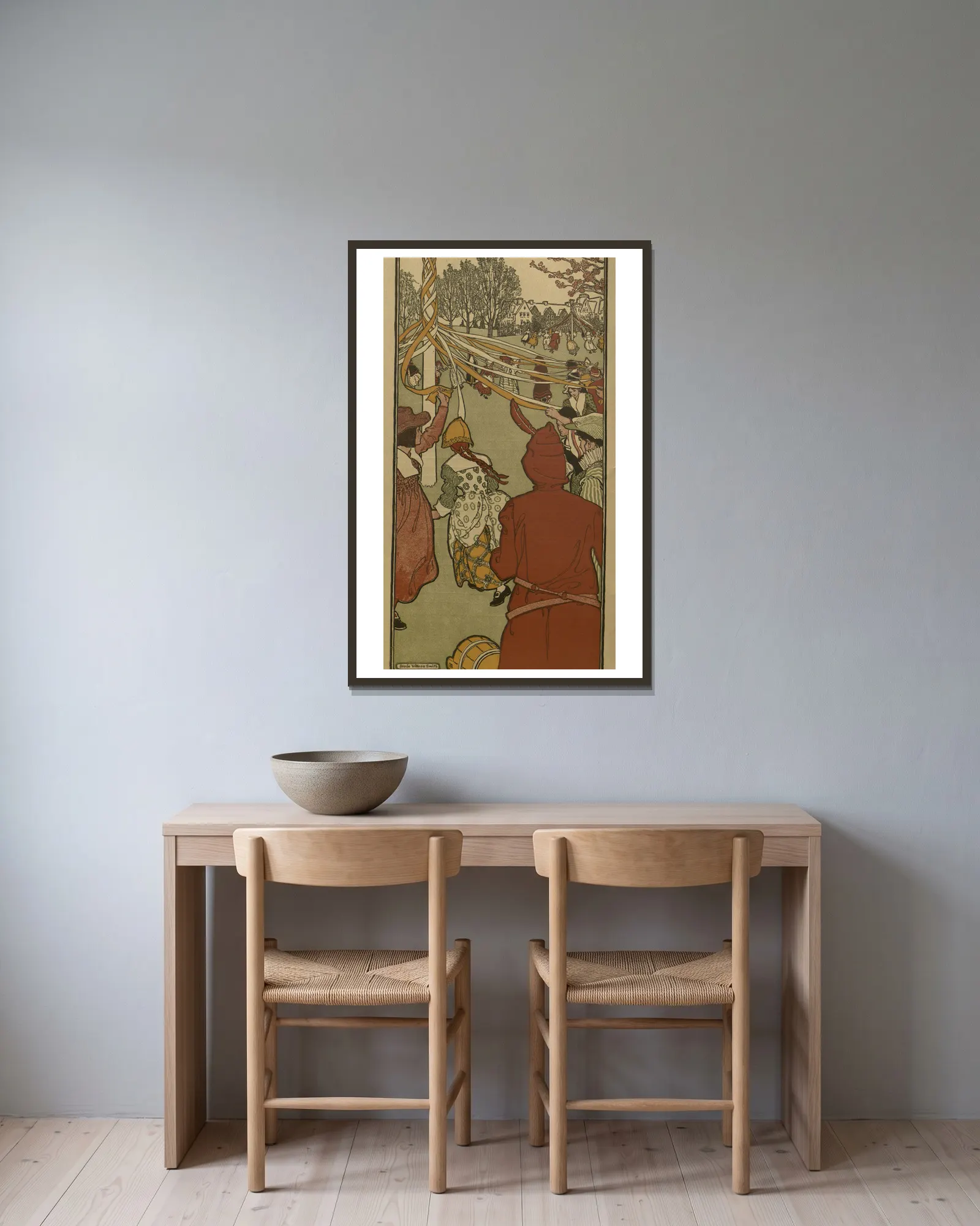 May av Jessie Willcox Smith inramad på en vägg