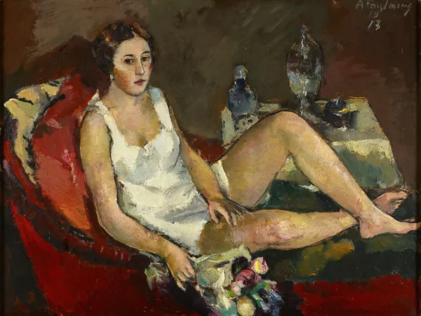 Junge Frau Auf Rotem Sofa av Anton Faistauer