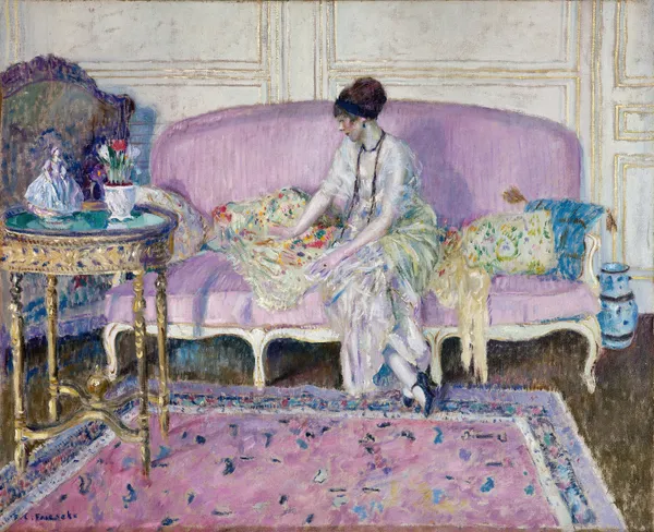Woman Seated on Sofa in Interior av Frederick Carl Frieseke