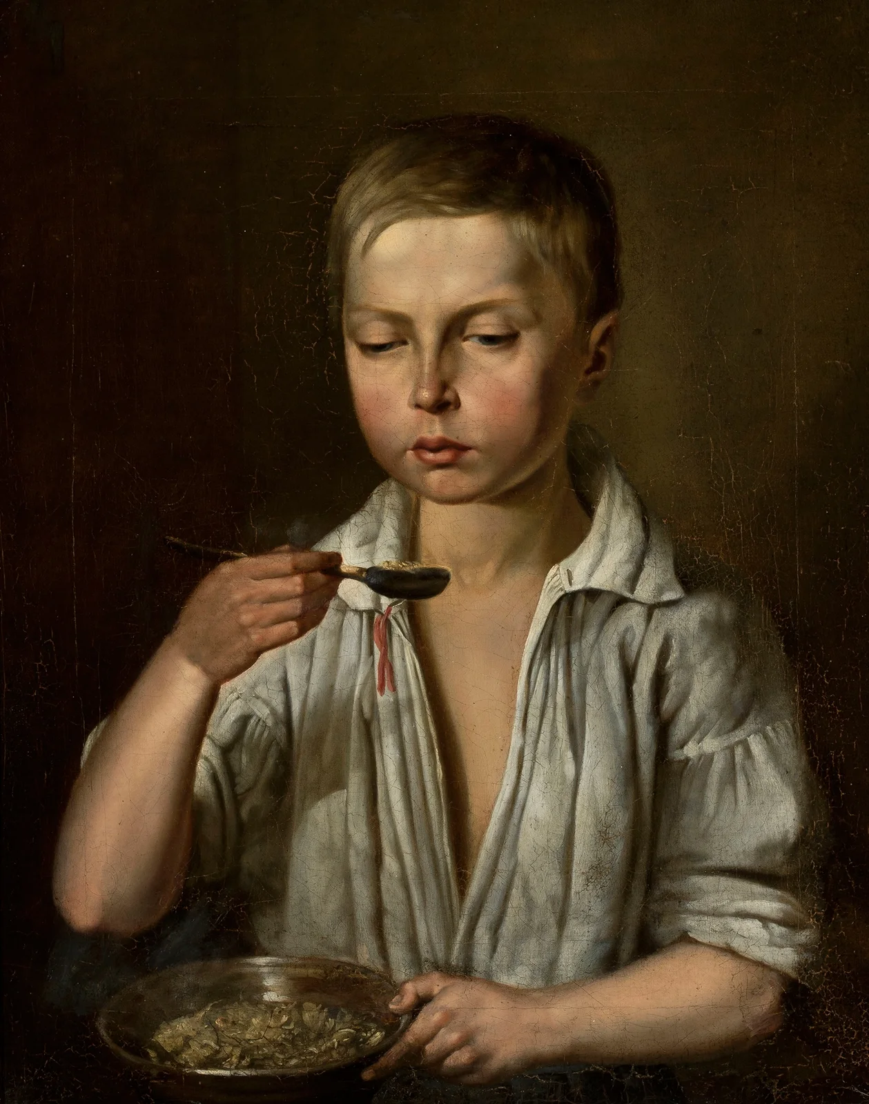 Boy at breakfast av Józef Simmler